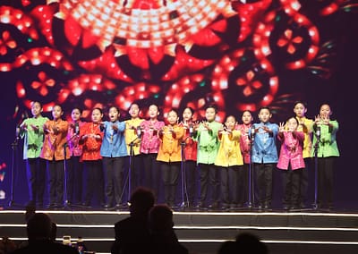 A group of people standing on stage at an Awards Gala or Global Peace Convention.